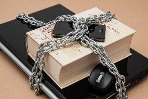 Photo by Pixabay Black Android Smartphone on Top of White Book